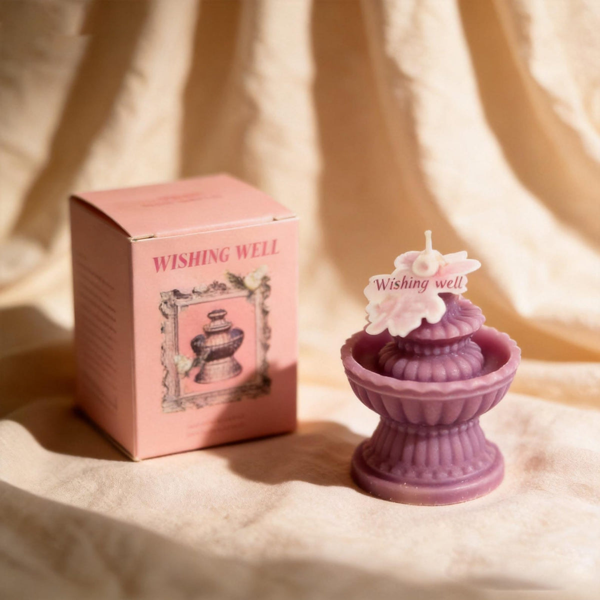 Wishing Fountain Candle shown in a product photo.