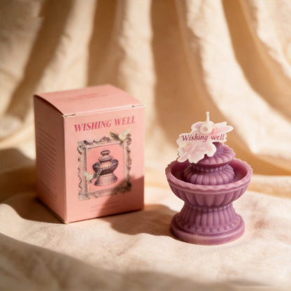 Wishing Fountain Candle shown in a product photo.