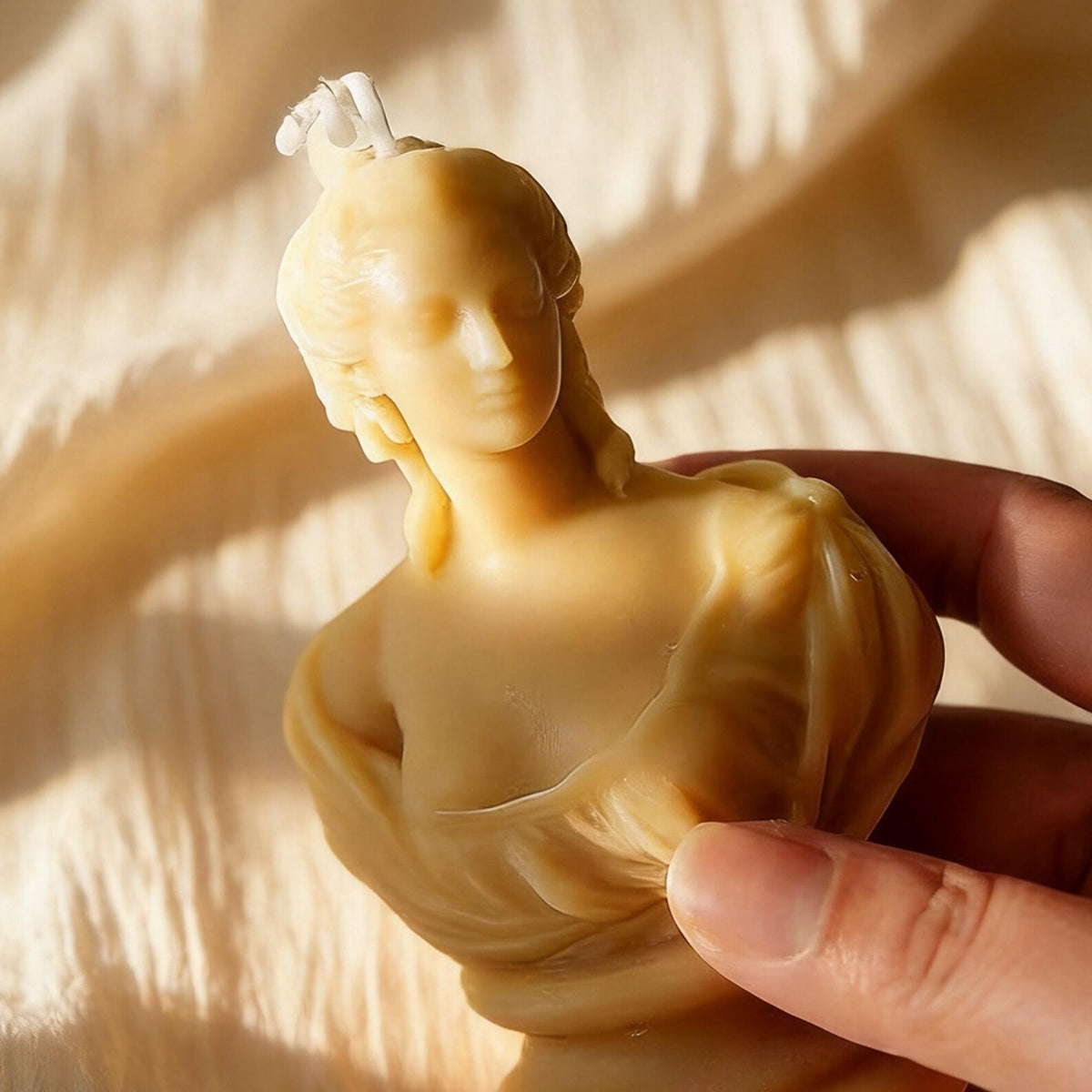 Alternate view of the classical bust candle.