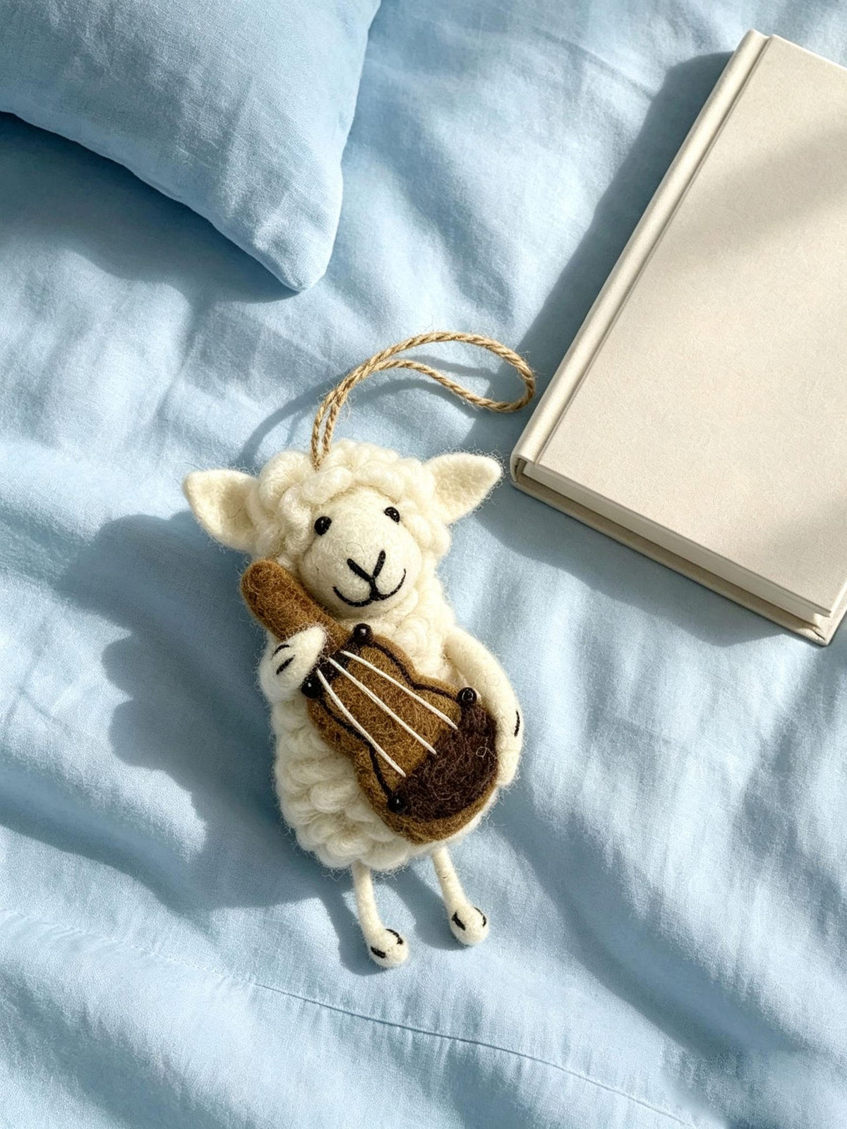 Alternate view of the wool felt animal aroma ornament.