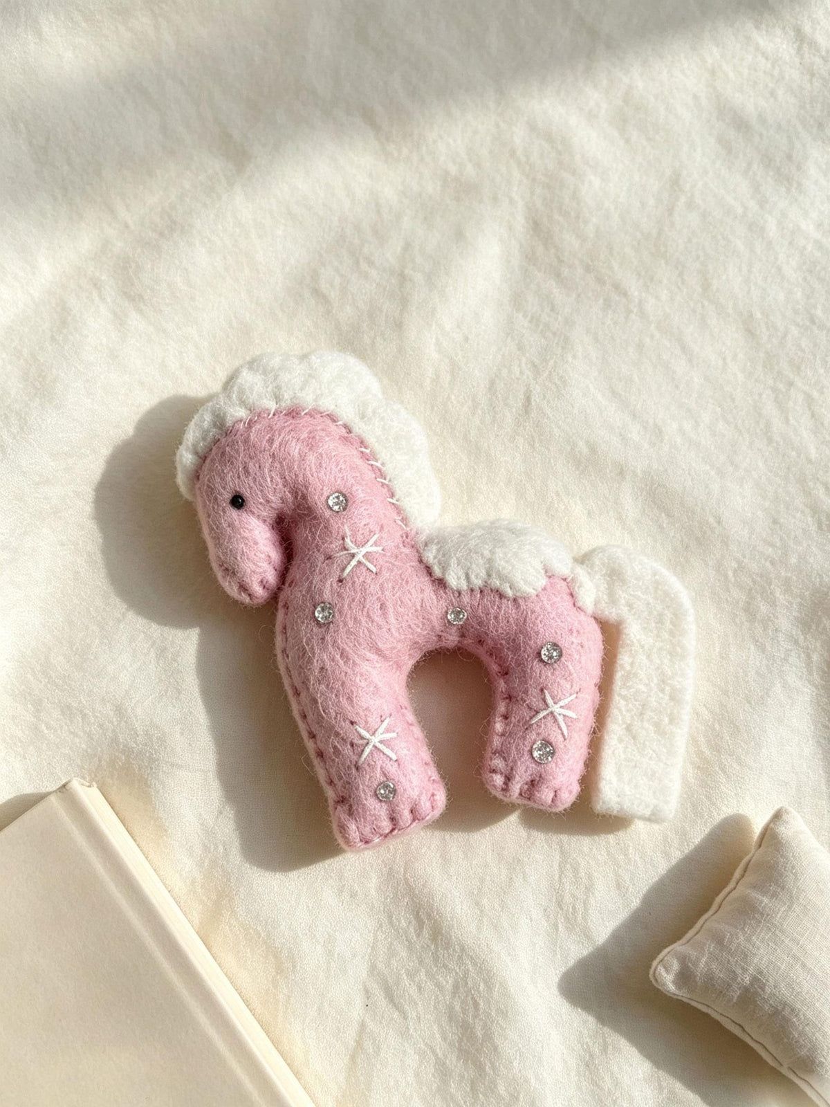 Alternate view of the wool felt animal aroma ornament.