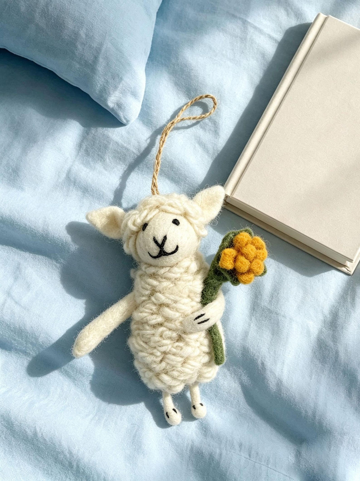 Alternate view of the wool felt animal aroma ornament.