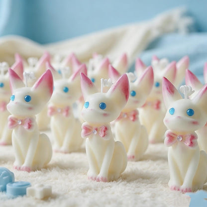 Alternate view of the cat candle with pink bow.