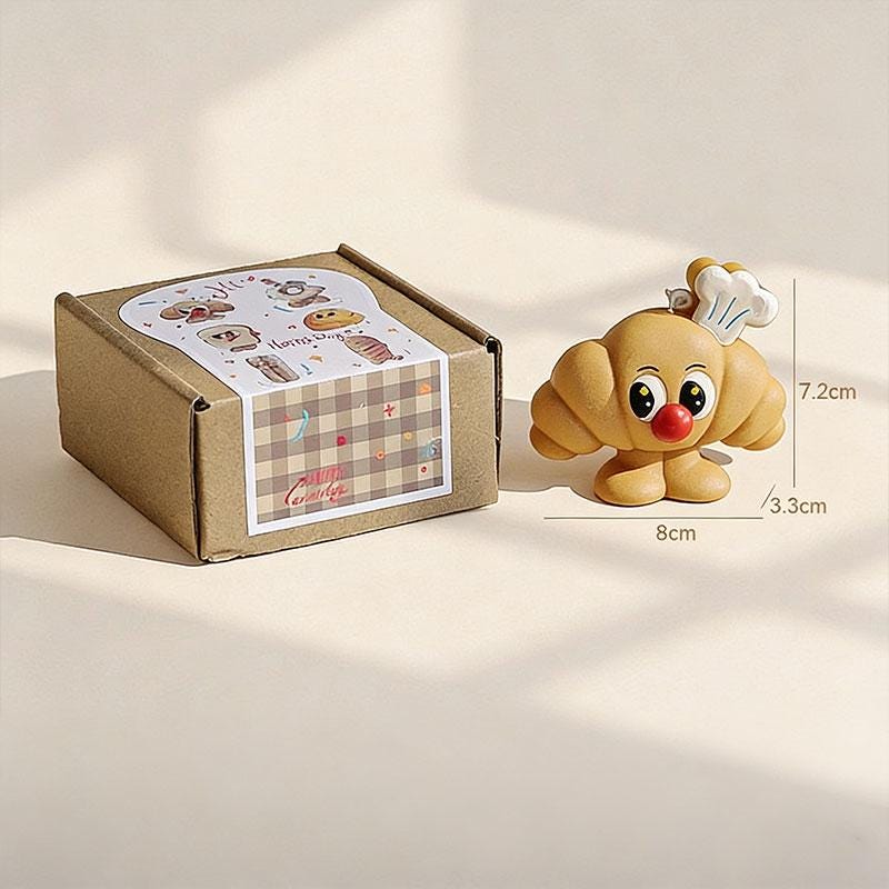 Additional view of the toast & croissant candle set.