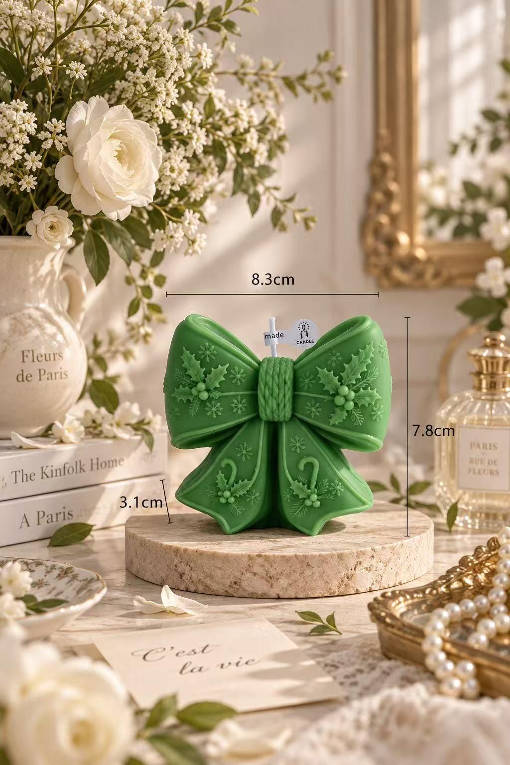 The christmas bow candle shown from another angle.